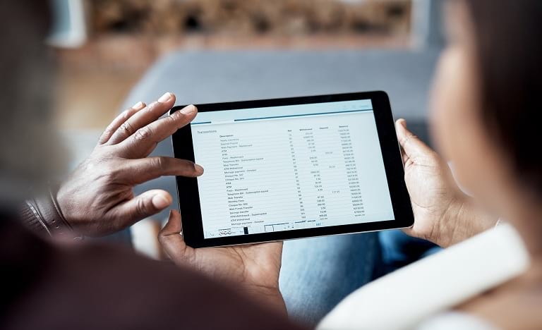 Person looking at their bank statement on their iPad